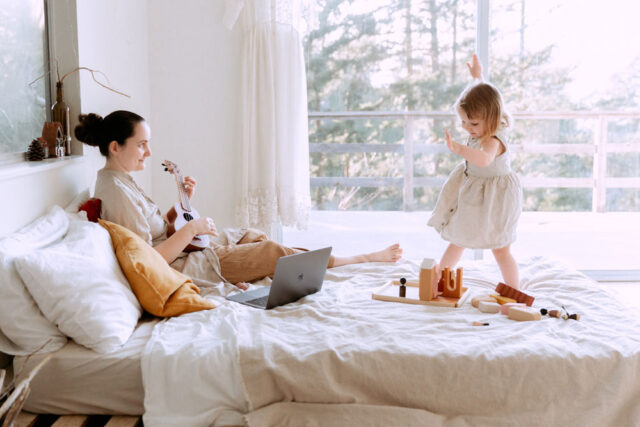 mother and child on bed
