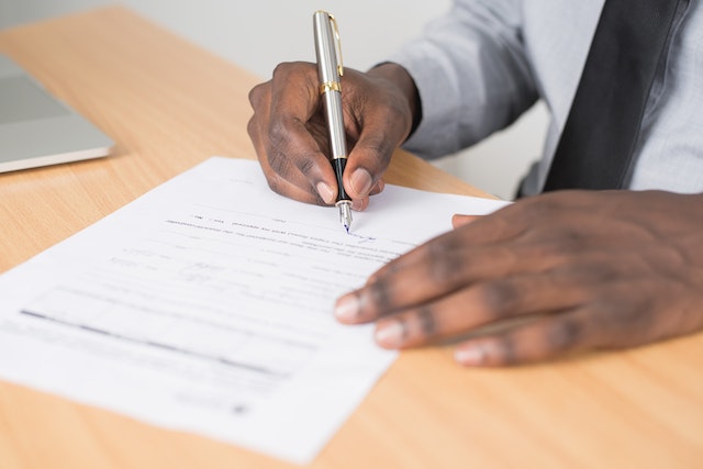 person signing documents in court