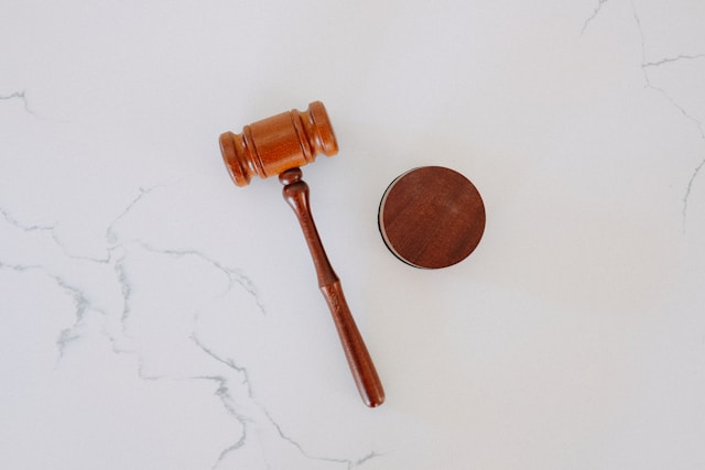 gavel placed on white marble surface