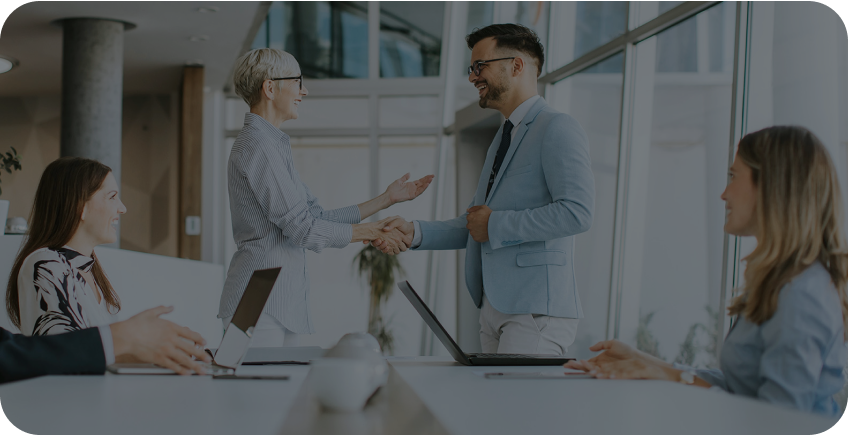 business people sitting around a table in an office