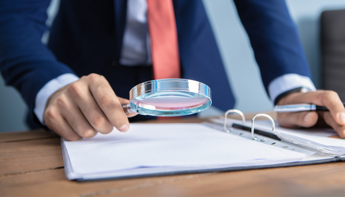 businessman looking with a magnifier