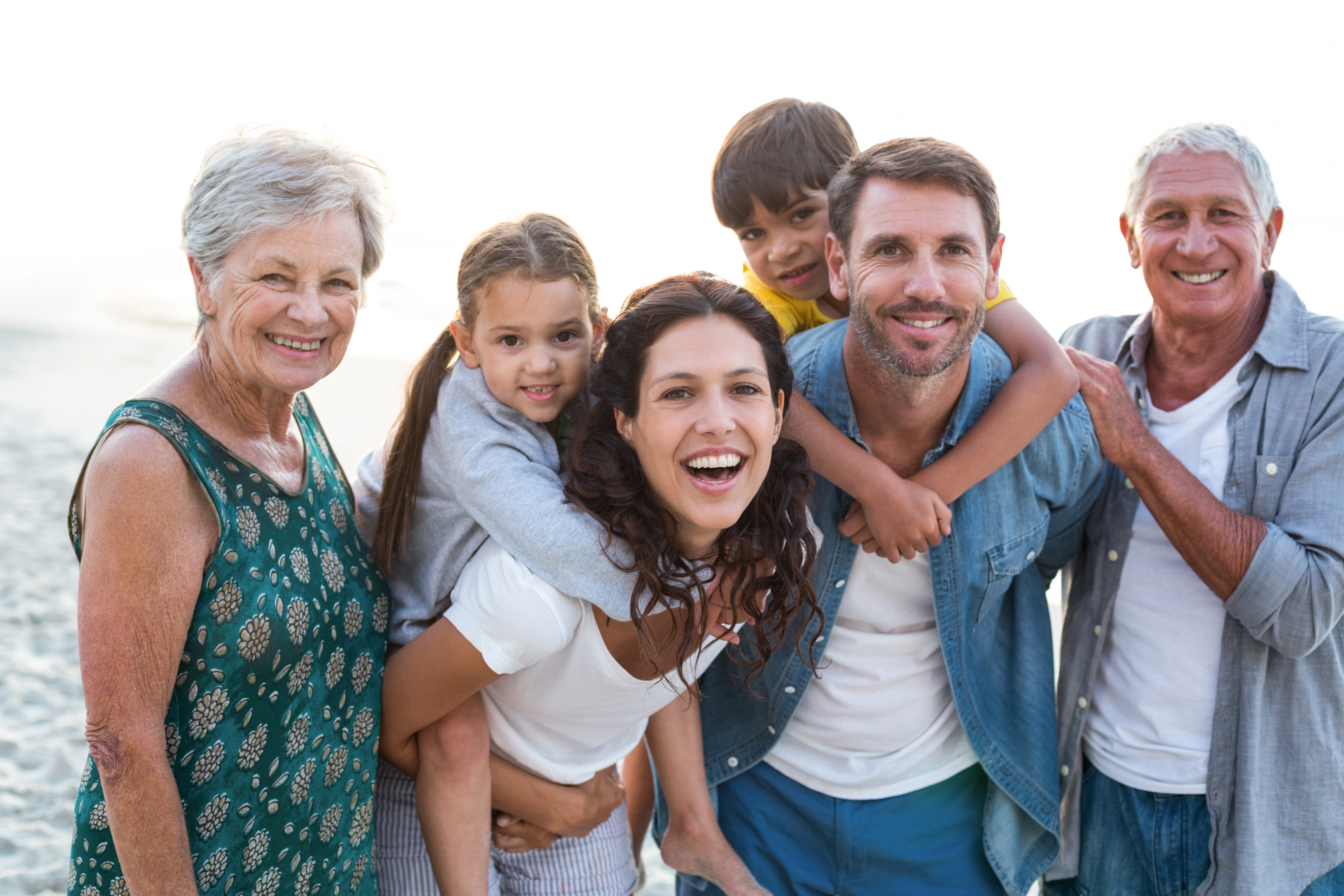 Happy family posing at the beach